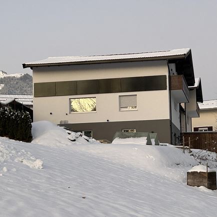 Frana Appartements im Winter bei Sonnenuntergang