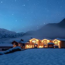 Alpegg Chalets Außenansicht Abend Winter