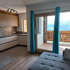 Wohnzimmer mit Küche