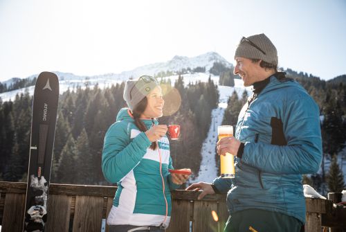 Snack stop with the children in a ski lodge - St. Johann in Tirol region