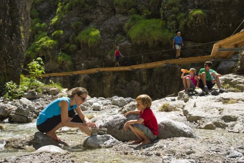 Family playing in the Griesbachklamm gorge - St. Johann in Tirol region