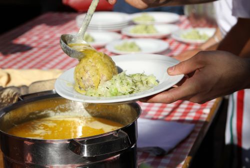 Dumpling with butter at the dumpling festival - St. Johann in Tirol region