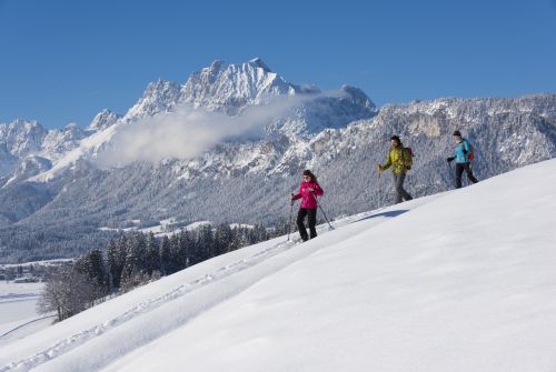 Snow-shoe hiker and the Wilder Kaiser - St. Johann in Tirol region